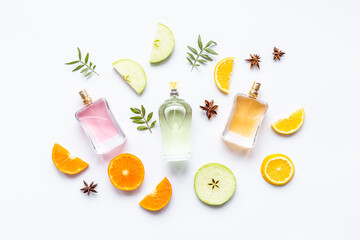 Set of perfume bottles with fragrance spaces and fruits