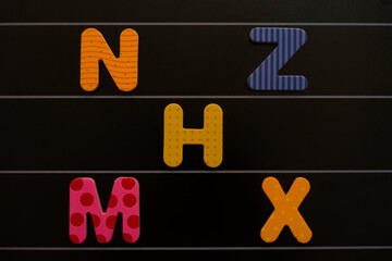 colorful letters on a board with white rows