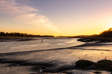 Fototapeta na wymiar River Dee estuary at sunset in winter at Kirkcudbright, Scotland