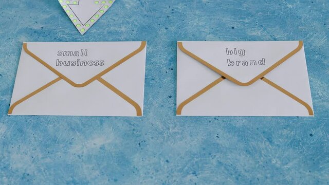 Small Business Vs Big Brand Texts Over Newsletter Email Envelopes With Arrow Pointing Towards The Small One, Supporting Small Local Businesses