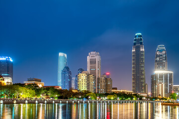 Naklejka premium Night view of modern architecture street along Haihe River in Tianjin