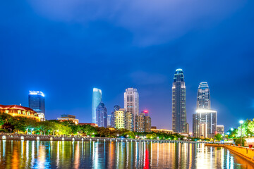 Fototapeta na wymiar Night view of modern architecture street along Haihe River in Tianjin