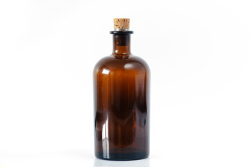 Brown apothecary glass bottle with cork stopper. Isolated white background. For magical potions...