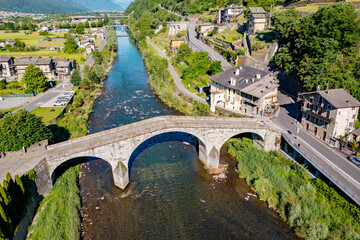 Naklejka premium Ganda bridge over the Adda river in the town of Morbegno in Valtellina, Italy