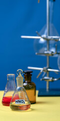 flasks and tripod in a science laboratory. Color background