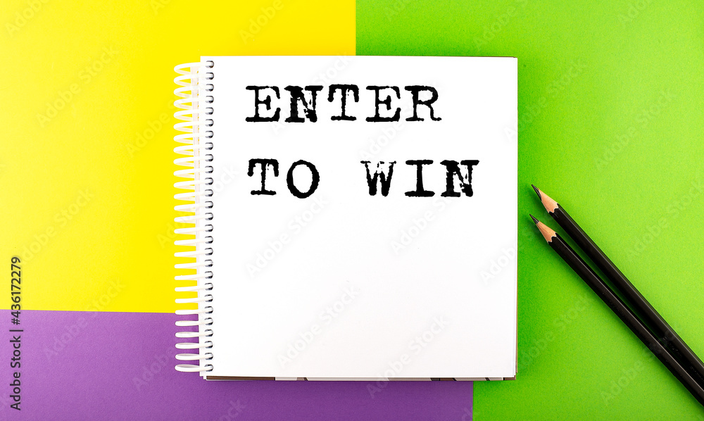 Poster minimal work space : sketchbook on the colorful background with enter to win text