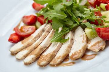 chicken fillet with salad and strawberries