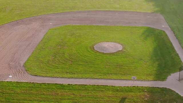 Empty baseball field near the school. Covid-19 and sports. Drone track shot