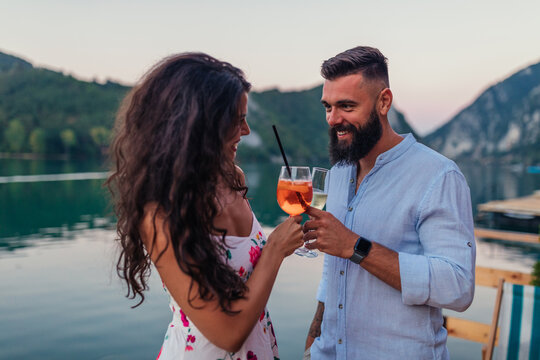Couple celebrating outdoors with wine