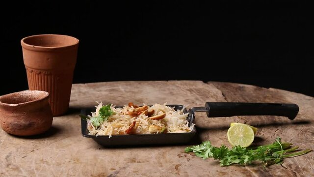 Semiya Upma or Vermicelli Uppuma or uppittu is a popular breakfast menu from south India. served in a bowl. selective focus
