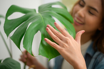 Obraz premium Happy young beautiful woman enjoying and relaxing leisure activity in garden at home