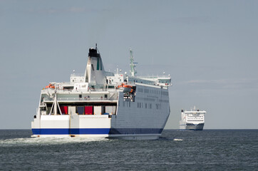 Naklejka premium MARITIME TRANSPORT - Passenger ferrys on waterway to seaport 