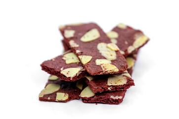 crispy brownies cracker snack with almond nut on white
