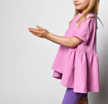 Cropped photo of the girl's child folded her palms in front of her and put them forward