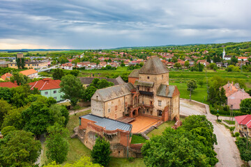 Obraz premium Aerial panoramic view about Castle of Simontornya with cloudy sky at the background.