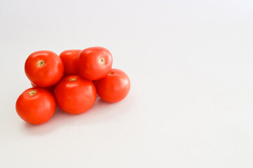 Tomatoes isolated on white background.Fresh raw vegetables.Full depth of field.