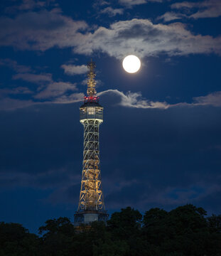 TV tower and lookout tower at night with full moon / prague, petrin