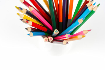 Fototapeta premium stack of wooden colored crayons on white background