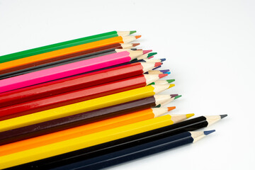 a stack of wooden colored pencils for drawing