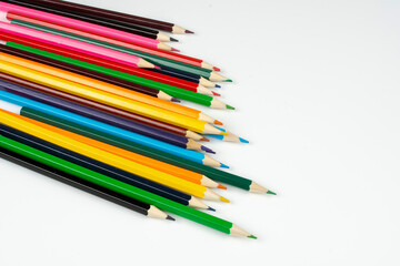 a stack of wooden colored pencils for drawing