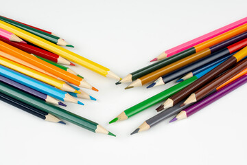 a stack of wooden colored pencils for drawing