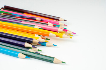 a stack of wooden colored pencils for drawing