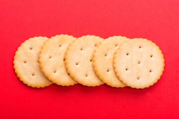 cracker close-up. salty cracker on a red background