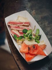 Grilled bbq tuna with watermelon and micro greens