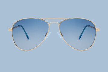 sunglasses golden metallic frame and blue polarized lenses isolated on blue background
