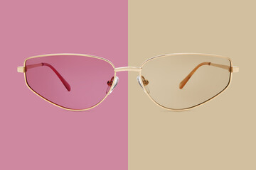 sunglasses golden metallic frame and polarized lenses isolated on beige and pink background