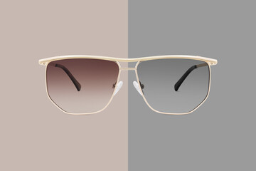 sunglasses golden metallic frame and brown and gray gradient polarized lenses isolated on background