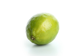 Fresh single lime isolated on white background