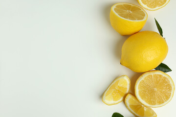 Ripe lemons on white background, space for text