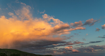Beautiful sky with colorful dramatic clouds after sunset. Sky nature background.
