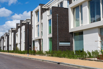 Modern houses in a row in a new residential district in Groningen.