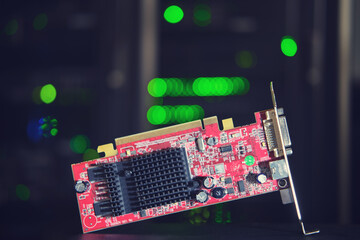 Video card on the background of computer equipment for cryptocurrency mining in the server room
