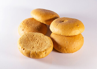 Five traditional handmade baked Bela biscuits on white Background. It is a common companion at afternoon tea to many people in Chittagong, Bangladesh. chittagonian local food served with tea.