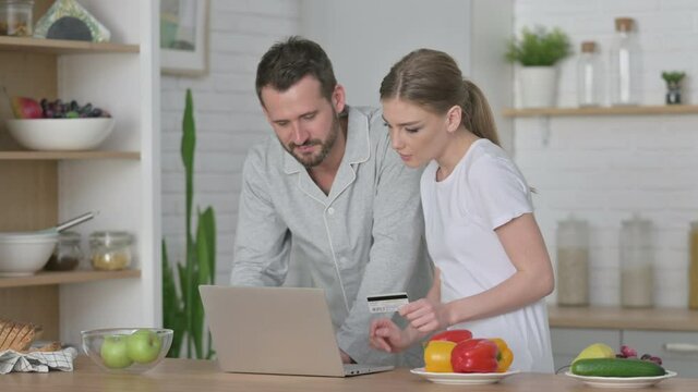Woman and Man making Online Payment on Laptop