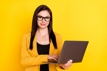 Photo of smart young ceo lady type laptop wear eyewear yellow blazer isolated on vivid color background