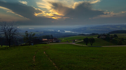 Fototapeta na wymiar green field in austria at sunset