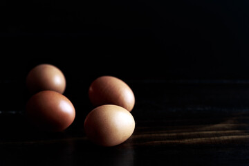 Chicken Brown eggs on a wooden rustic background