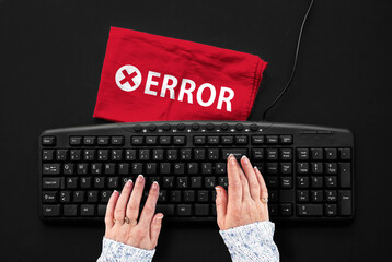 ERROR. Woman hands on pc keyboard and error word on rag
