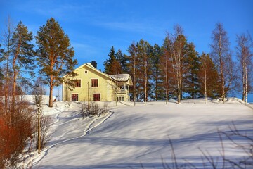 Fototapeta na wymiar Wooden house in the small Swedish town Petiknaes in Vasterbotten