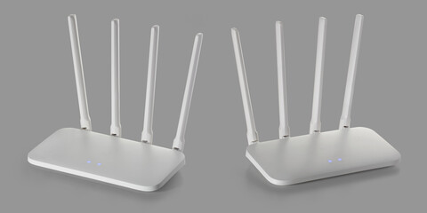 Two white wi-fi router with external antennas on a grey background. Full depth of field. With...