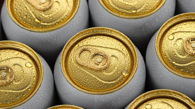 cold aluminum cans with beer top view, rotation. Many cans of beer or other drinks. 4K UHD video