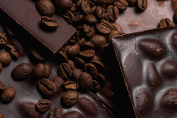 coffee beans close-up and chocolate. Dark chocolate bar. Natural background of cinnamon color.