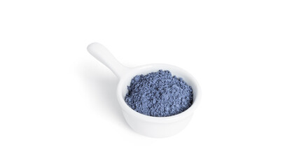 Blue matcha powdered tea isolated on white background.