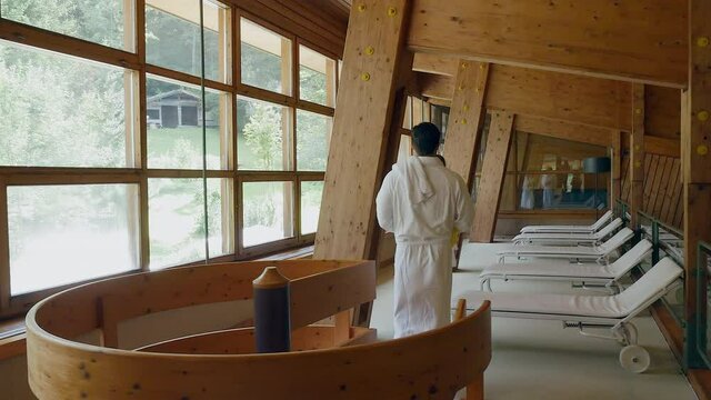 Couple in white bathrobes at spa resort, Alta Badia, Italy