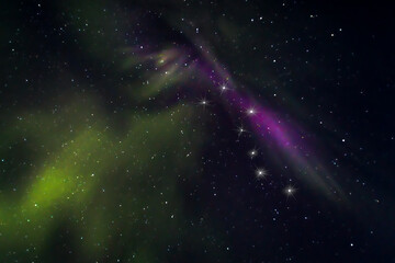Fototapeta na wymiar Violet and green aurora and the constellation Ursa Major