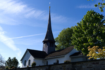 Fototapeta na wymiar Old protestant church of Zurich Witikon on a hill at springtime. Photo taken May 28th, 2021, Zurich, Switzerland.